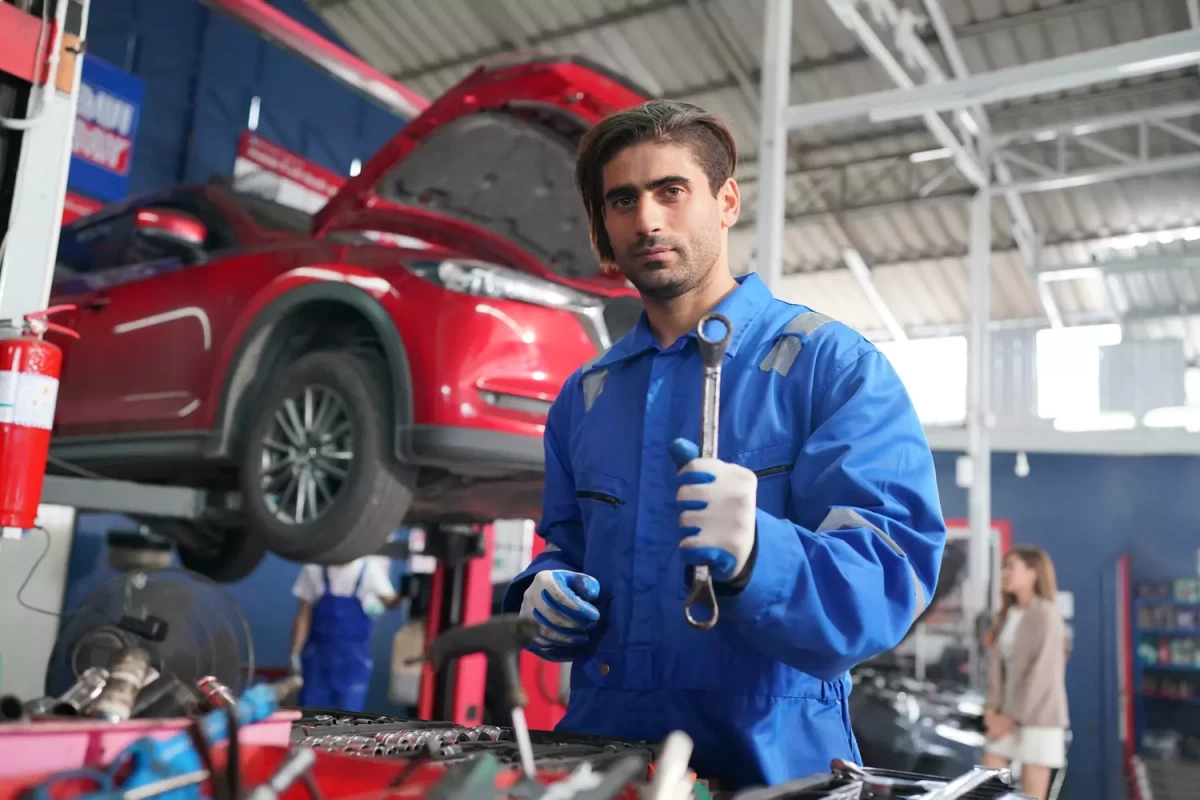 mechanic-in-blue-overalls-checking-serviceability-2025-01-29-08-37-41-utc